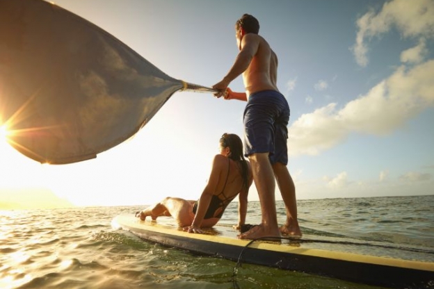 A Couple Enjoying the Sunset on a Stand-up Paddle Board at Isla Bella Beach Resort in the Florida Keys