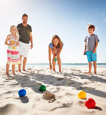 A Family Enjoying the Sun and Sand, Playing Bocce at Isla Bella Beach Resort in the Florida Keys