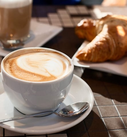 A pair of croissants and cafe lattes for breakfast at Isla Bella Beach Resort