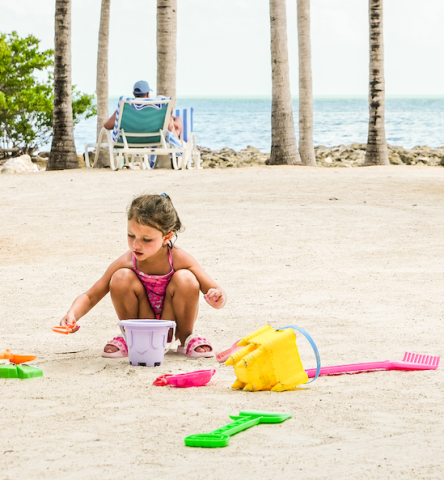 two young children playing with sand